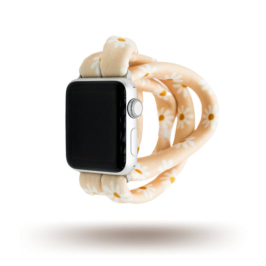 Apricot Daisies Yoga Band® featuring a white and yellow floral print on an apricot fabric background. A stretchy, breathable handcrafted watch strap compatible with Apple Watch, Fitbit, and Samsung Galaxy.