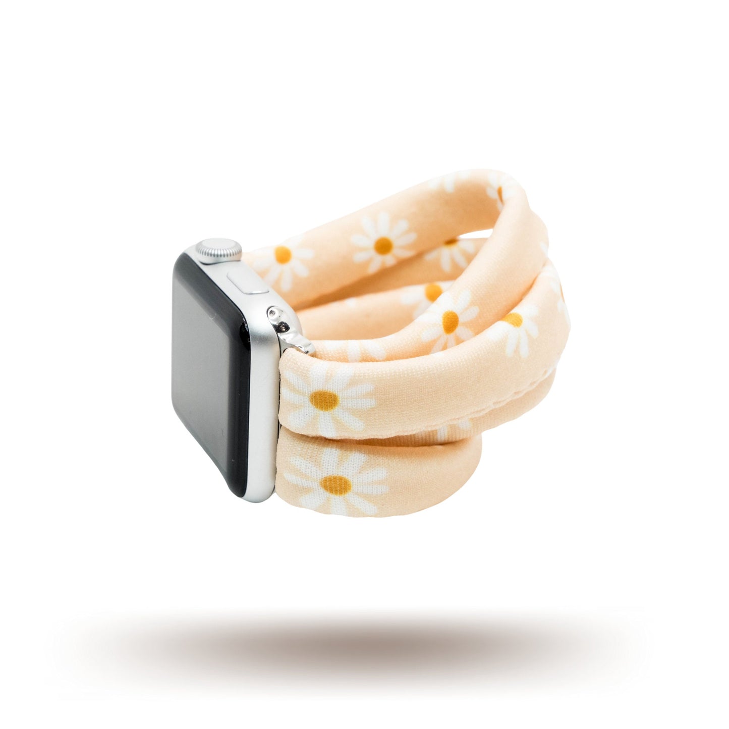 Apricot Daisies Yoga Band® featuring a white and yellow floral print on an apricot fabric background. A stretchy, breathable handcrafted watch strap compatible with Apple Watch, Fitbit, and Samsung Galaxy.