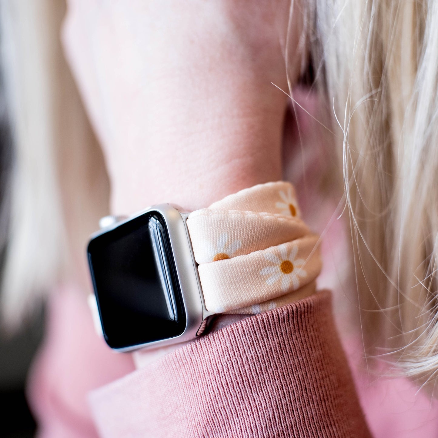 Apricot Daisies Yoga Band® featuring a white and yellow floral print on an apricot fabric background. A stretchy, breathable handcrafted watch strap compatible with Apple Watch, Fitbit, and Samsung Galaxy.