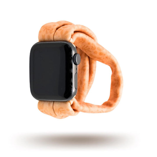 Autumn Orange Yoga Band® shown in a rich burnt orange fabric. This breathable, stretchy handcrafted watch strap is compatible with Apple Watch, Fitbit, and Samsung Galaxy models.