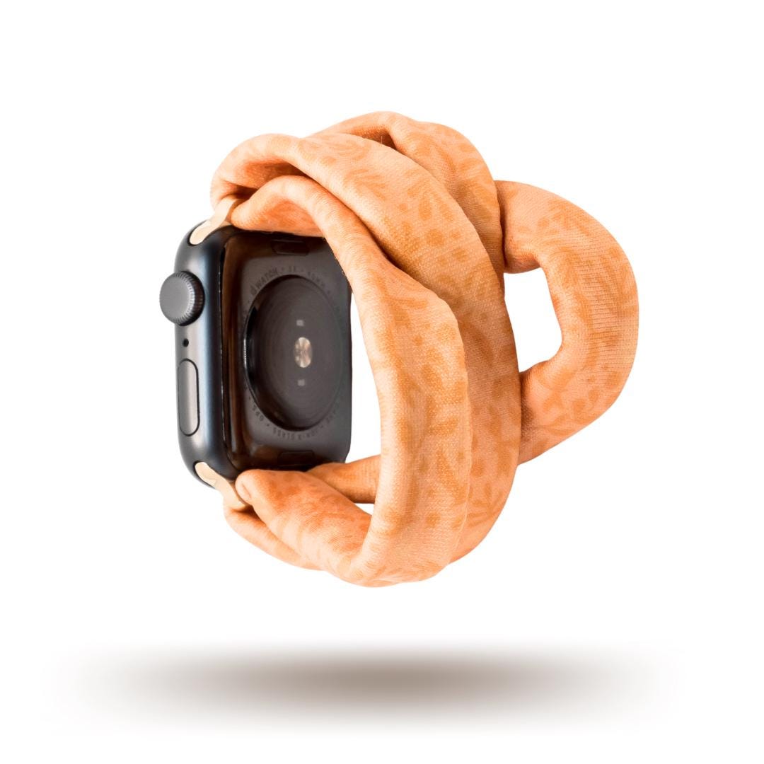 Autumn Orange Yoga Band® shown in a rich burnt orange fabric. This breathable, stretchy handcrafted watch strap is compatible with Apple Watch, Fitbit, and Samsung Galaxy models.