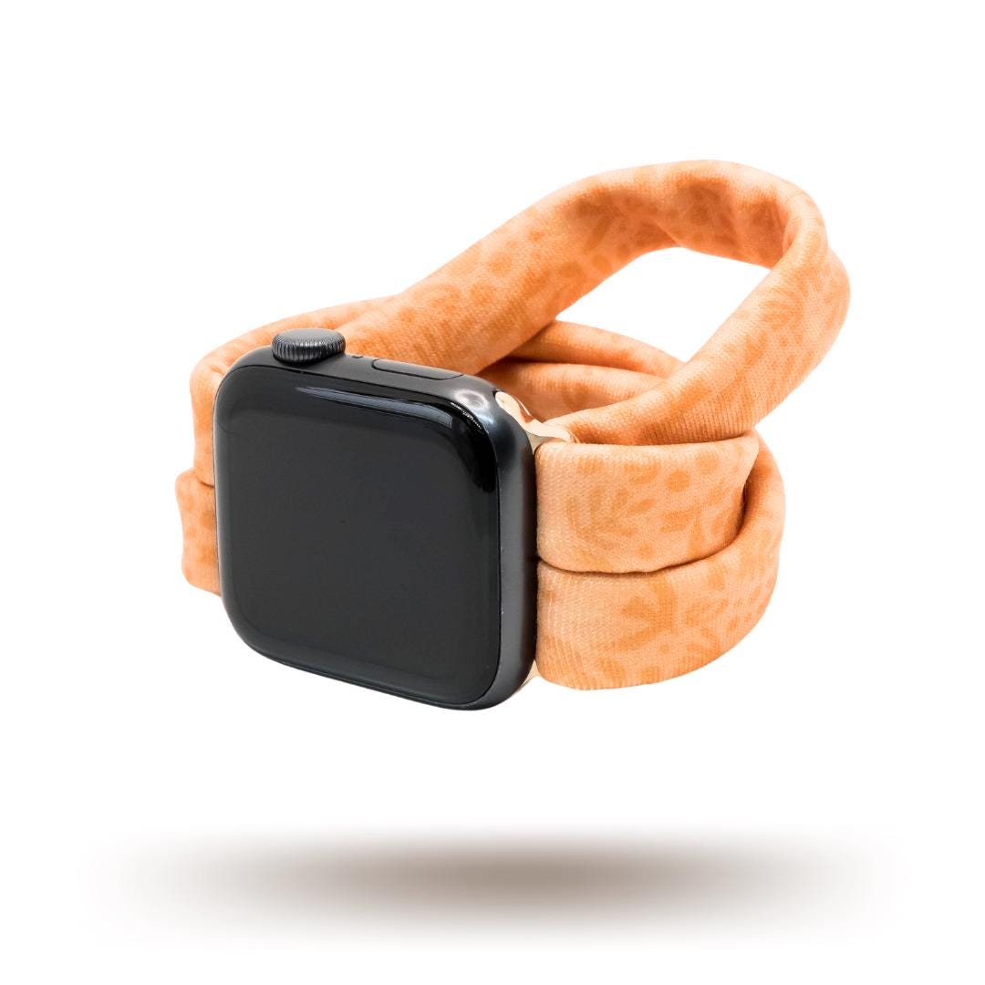 Autumn Orange Yoga Band® shown in a rich burnt orange fabric. This breathable, stretchy handcrafted watch strap is compatible with Apple Watch, Fitbit, and Samsung Galaxy models.
