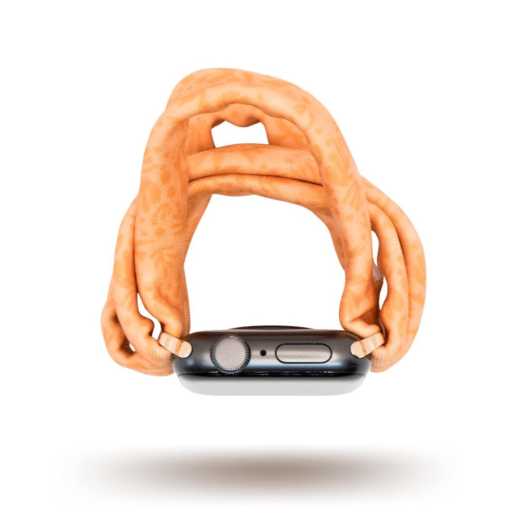 Autumn Orange Yoga Band® shown in a rich burnt orange fabric. This breathable, stretchy handcrafted watch strap is compatible with Apple Watch, Fitbit, and Samsung Galaxy models.
