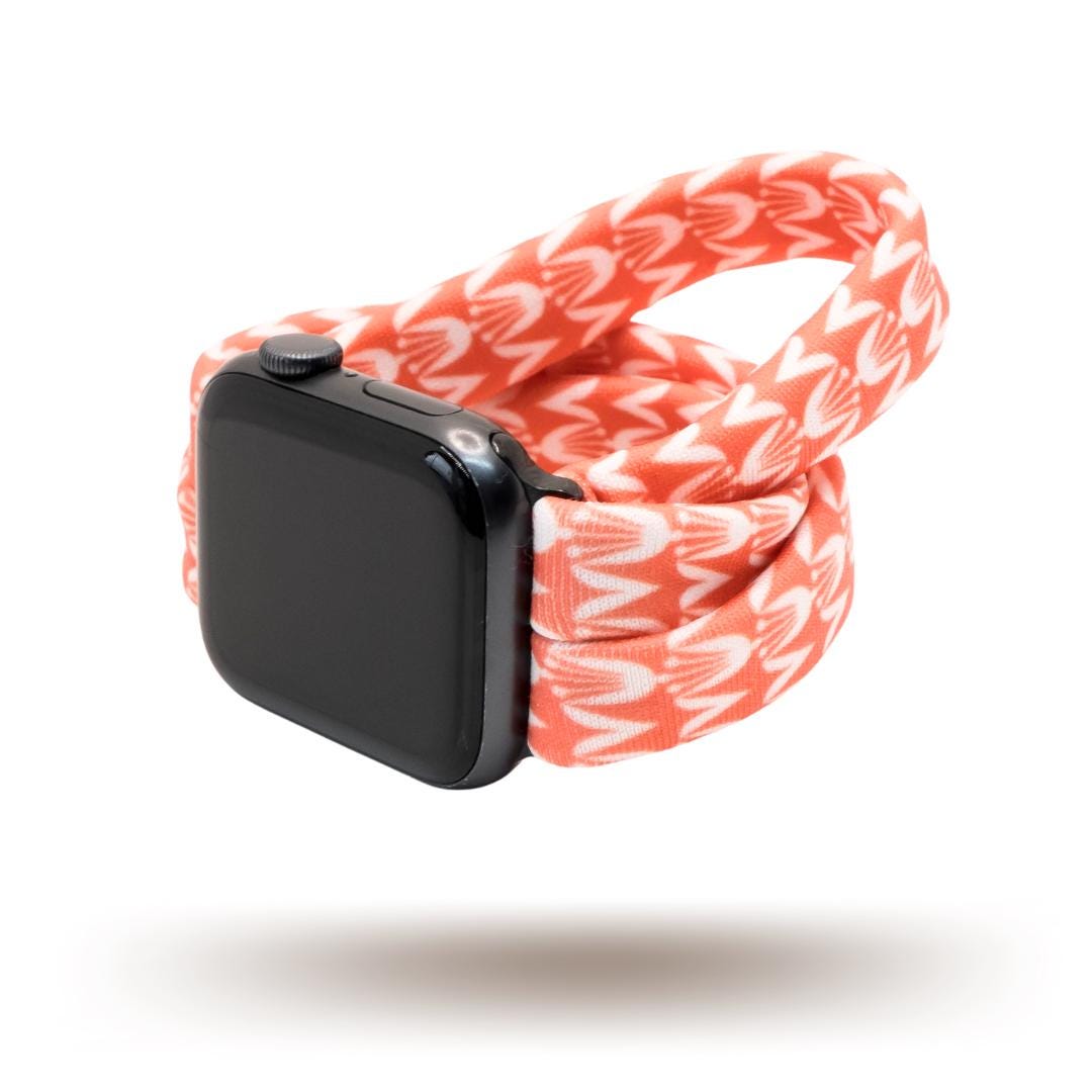 Berry Blooms Yoga Band® featuring a vibrant coral, salmon, and orange-pink floral print on a soft fabric background. A breathable, stretchy handcrafted watch strap compatible with Apple Watch, Fitbit, and Samsung Galaxy.