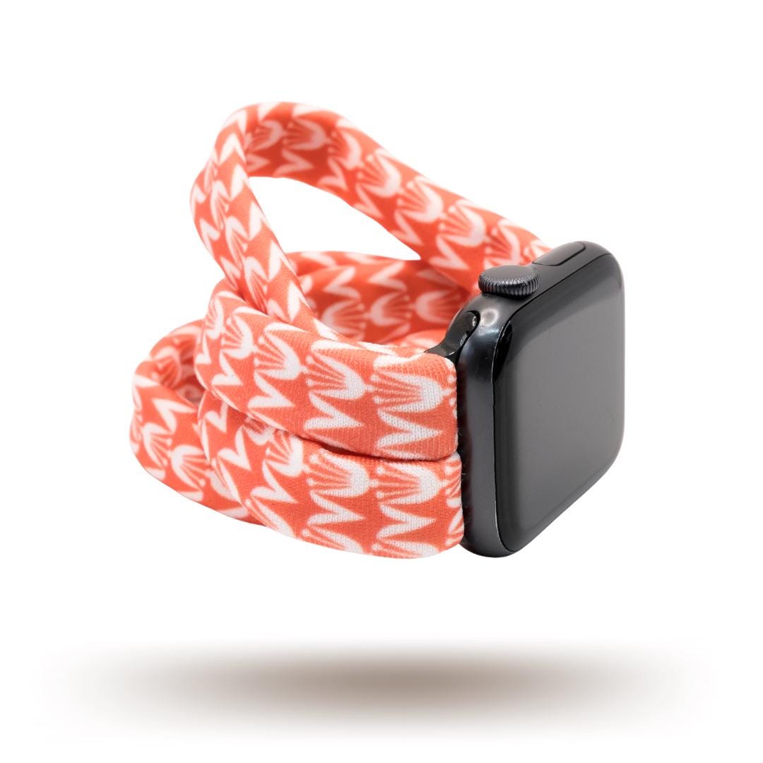 Berry Blooms Yoga Band® featuring a vibrant coral, salmon, and orange-pink floral print on a soft fabric background. A breathable, stretchy handcrafted watch strap compatible with Apple Watch, Fitbit, and Samsung Galaxy.