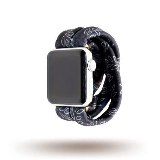 Blackberry Yoga Band® featuring a white leafy botanical print on a black fabric background. This breathable, stretchy watch strap with a patent-pending design is compatible with Apple Watch, Fitbit, and Samsung Galaxy models.