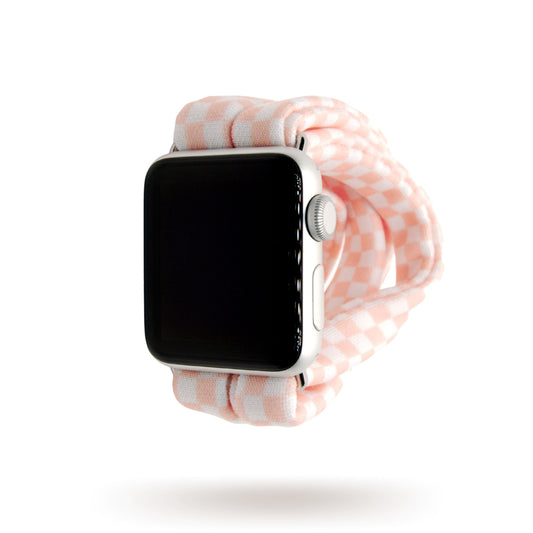 Blush Checkers Yoga Band® featuring a pink and white checkered gingham pattern. A breathable, stretchy watch strap with a patent-pending design compatible with Apple Watch, Fitbit, and Samsung Galaxy models.