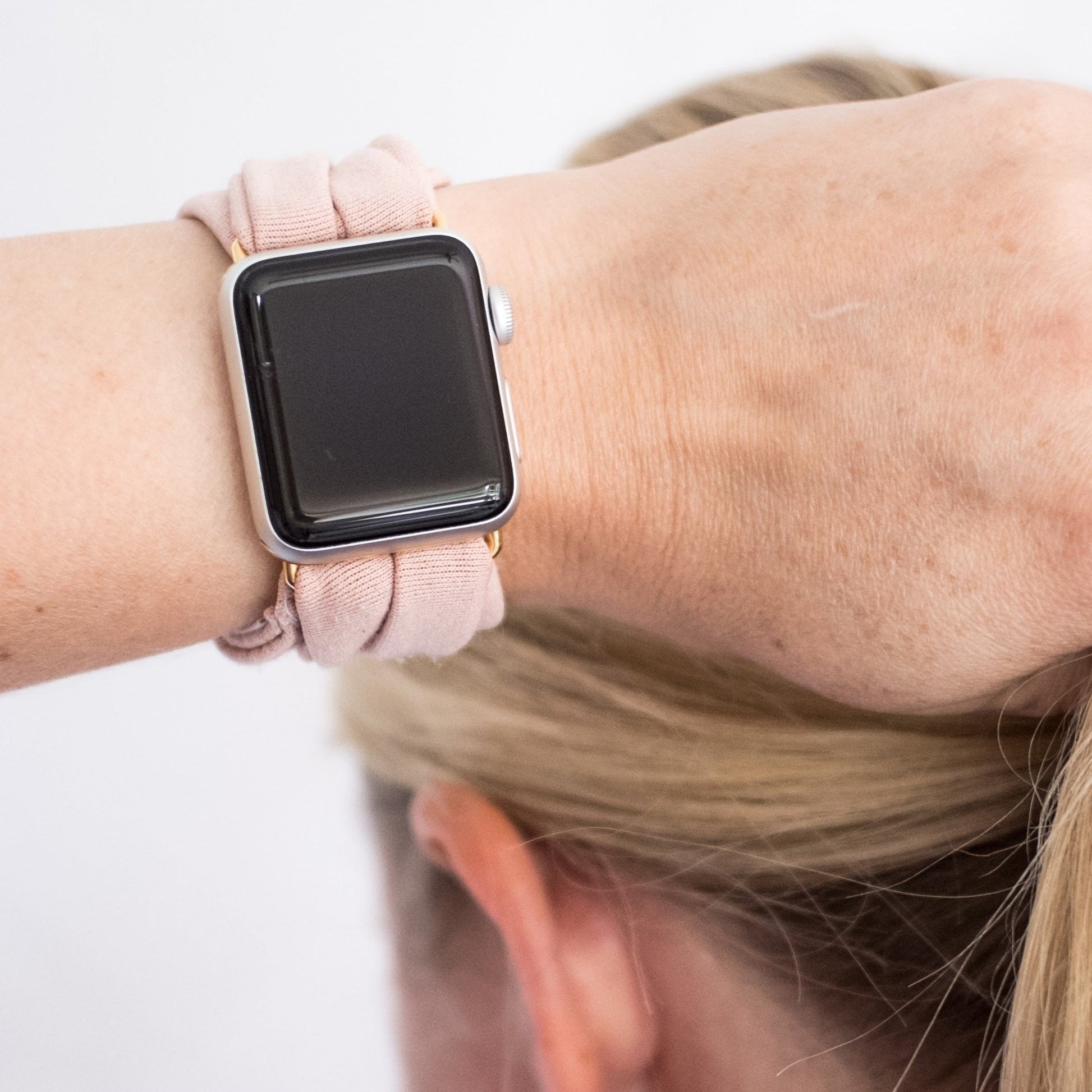 Blush Pink Yoga Band® in a solid pale pink knit fabric. A breathable, stretchy watch strap with a patent-pending design compatible with Apple Watch, Fitbit, and Samsung Galaxy models.
