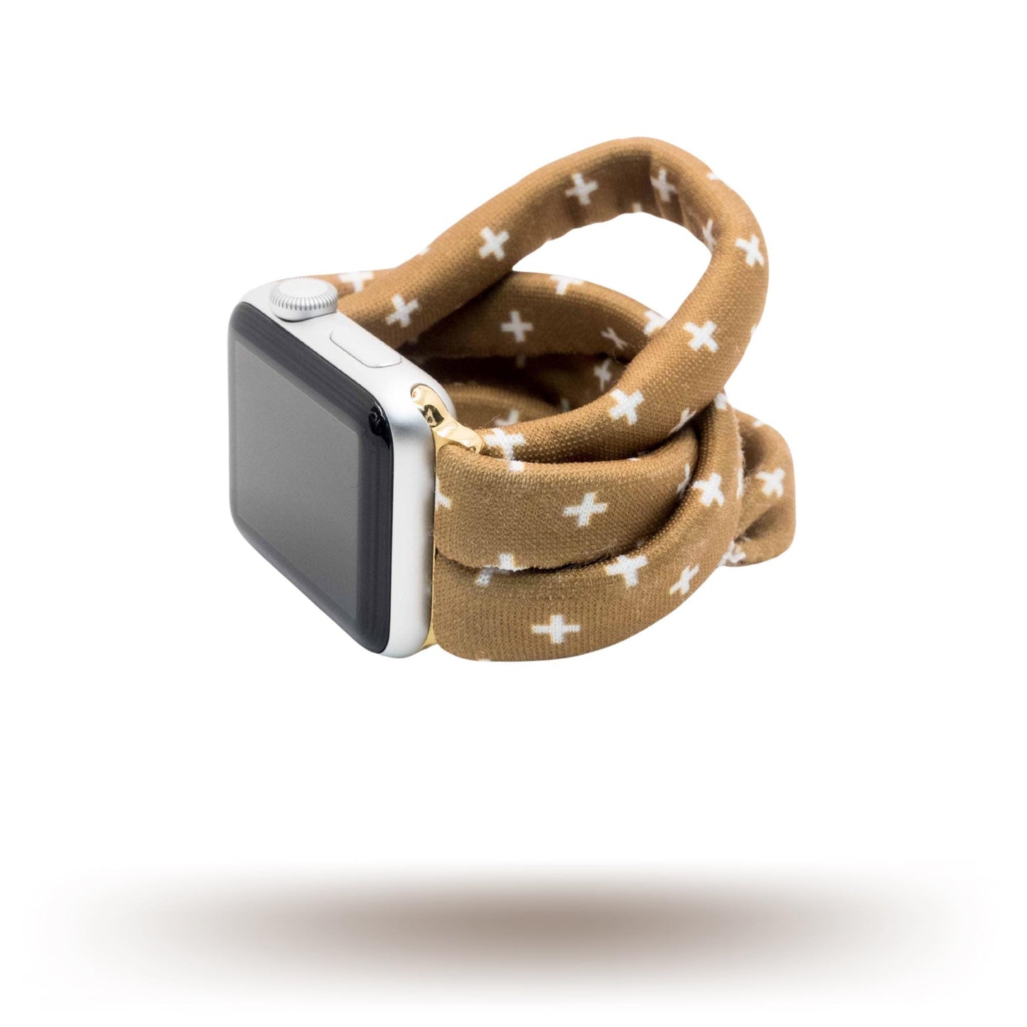 Chestnut Plus Yoga Band® featuring a white plus pattern on a warm brown fabric background. A breathable, stretchy watch strap with a patent-pending design compatible with Apple Watch, Fitbit, and Samsung Galaxy models.