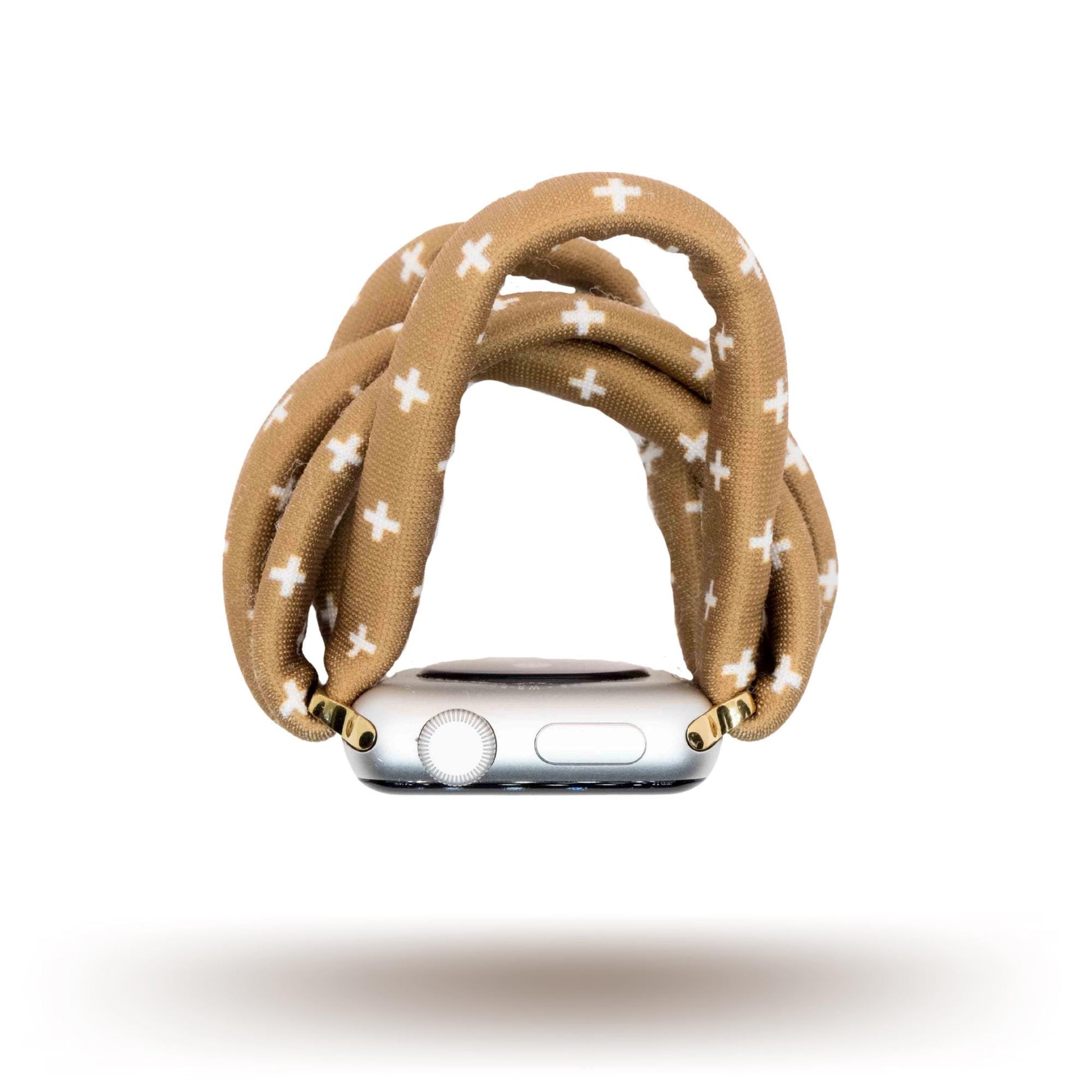 Chestnut Plus Yoga Band® featuring a white plus pattern on a warm brown fabric background. A breathable, stretchy watch strap with a patent-pending design compatible with Apple Watch, Fitbit, and Samsung Galaxy models.