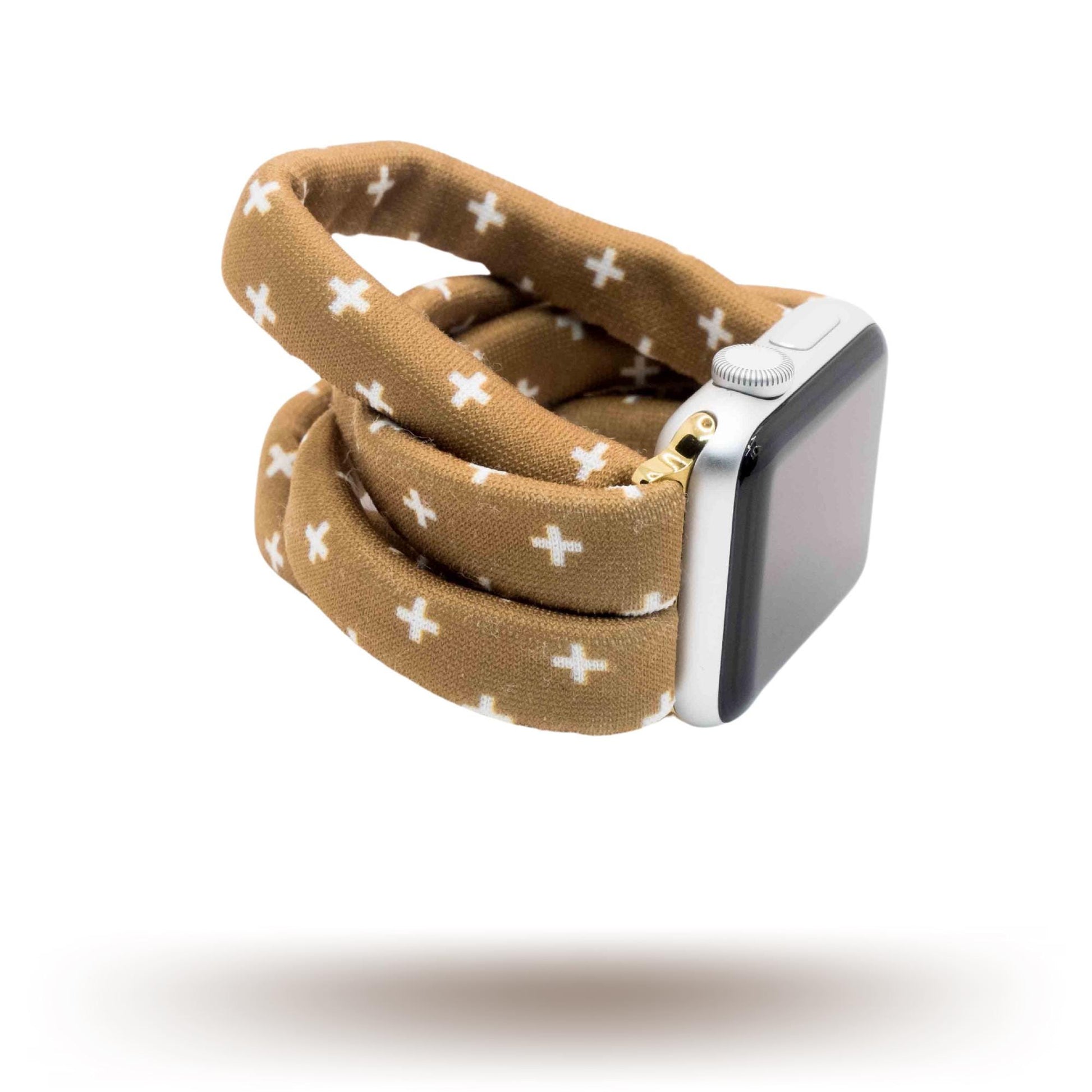 Chestnut Plus Yoga Band® featuring a white plus pattern on a warm brown fabric background. A breathable, stretchy watch strap with a patent-pending design compatible with Apple Watch, Fitbit, and Samsung Galaxy models.