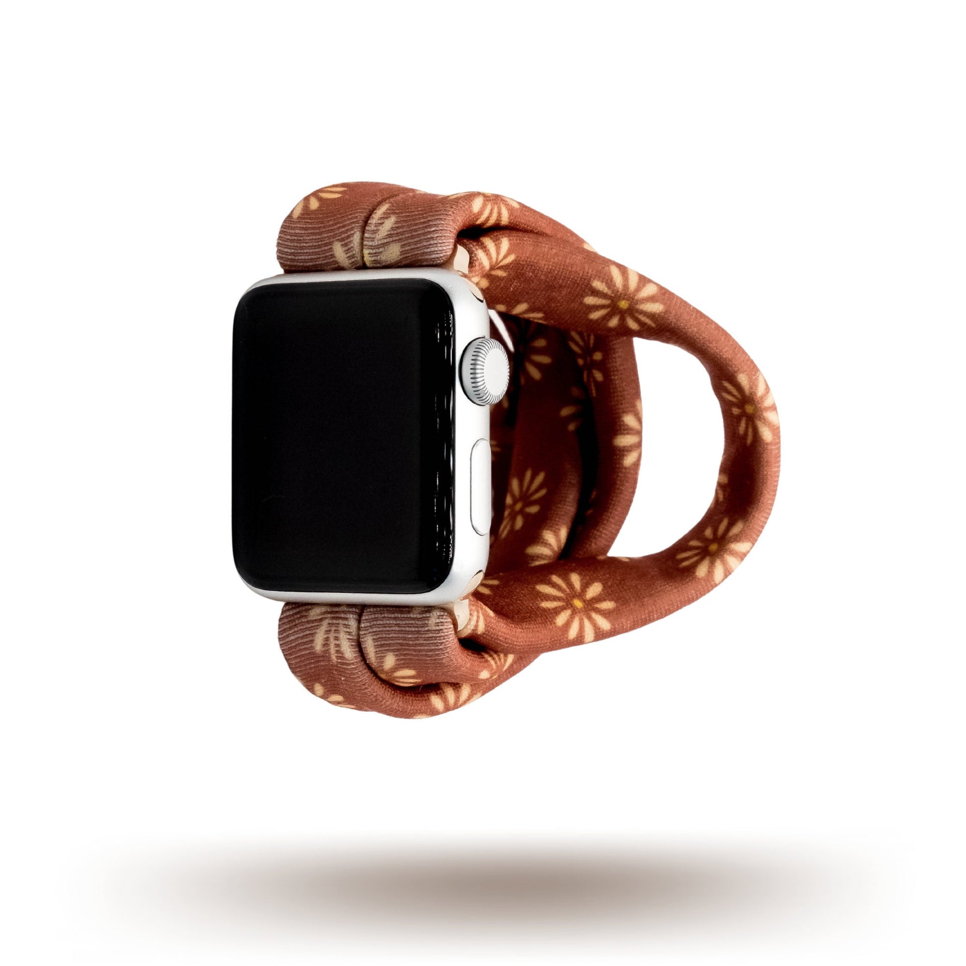 Copper Bloom Yoga Band® featuring a yellow and orange floral print on a rust-copper fabric. A breathable, stretchy watch strap with a patent-pending design compatible with Apple Watch, Fitbit, and Samsung Galaxy models.