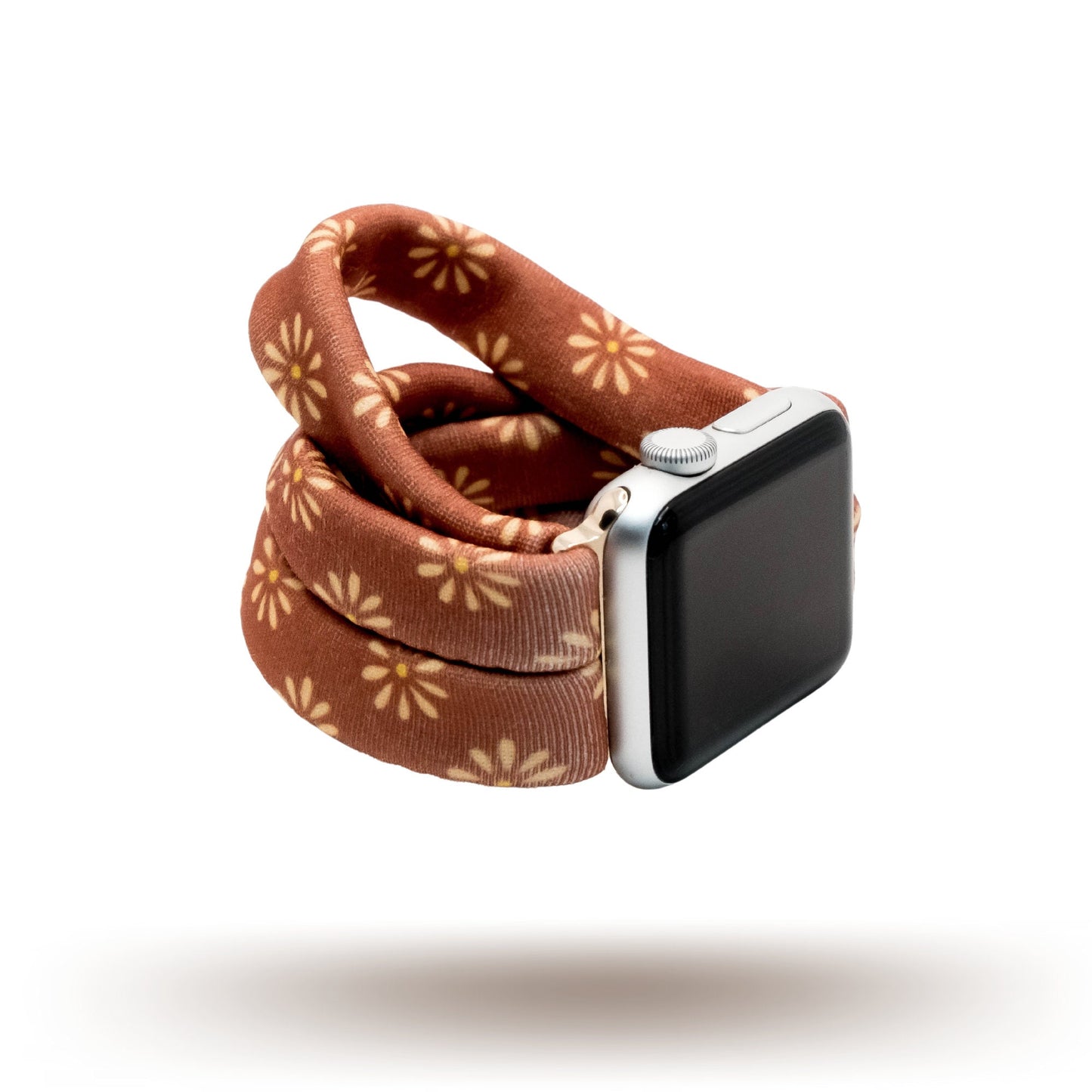 Copper Bloom Yoga Band® featuring a yellow and orange floral print on a rust-copper fabric. A breathable, stretchy watch strap with a patent-pending design compatible with Apple Watch, Fitbit, and Samsung Galaxy models.