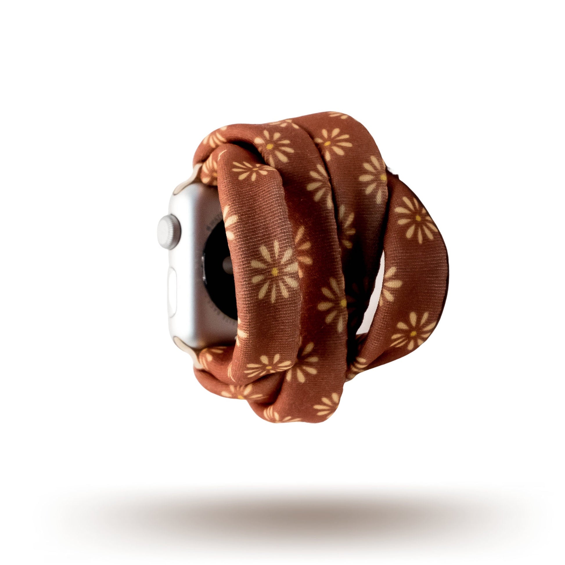 Copper Bloom Yoga Band® featuring a yellow and orange floral print on a rust-copper fabric. A breathable, stretchy watch strap with a patent-pending design compatible with Apple Watch, Fitbit, and Samsung Galaxy models.