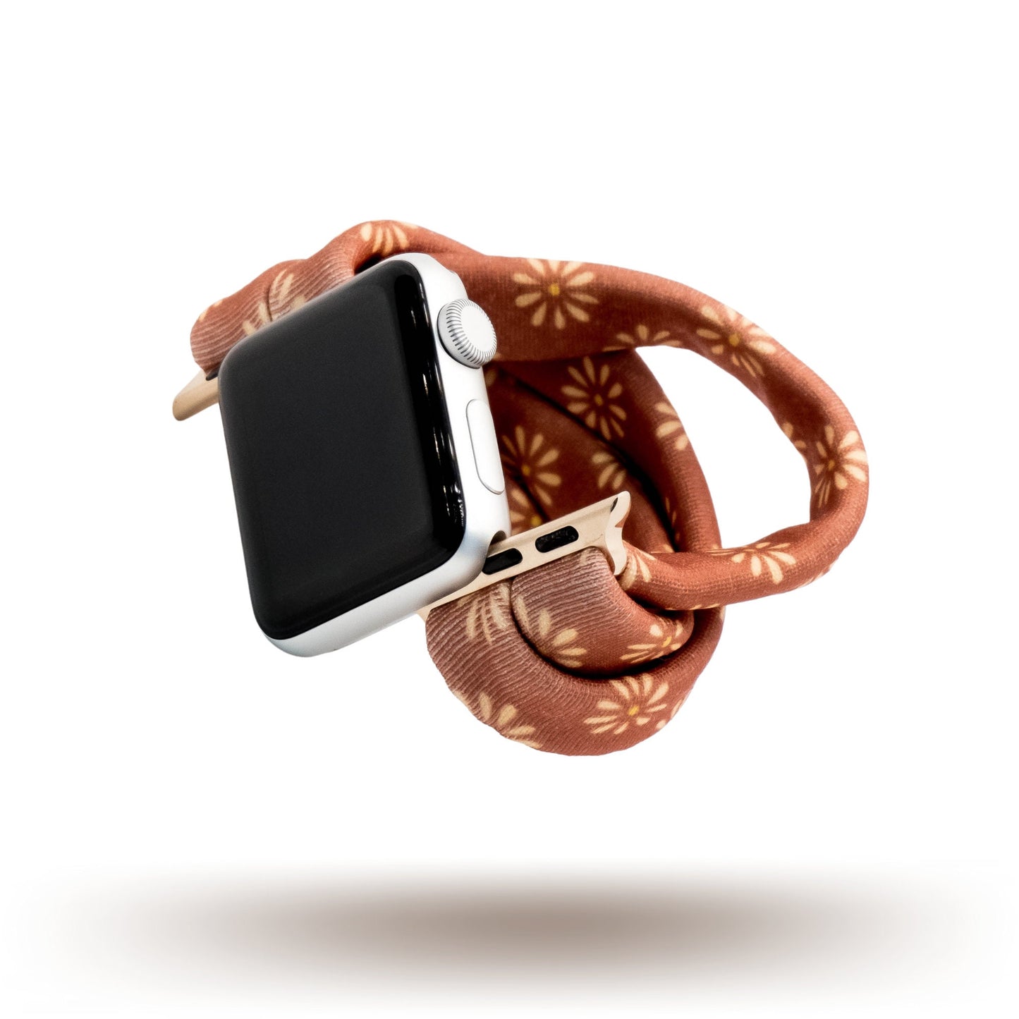 Copper Bloom Yoga Band® featuring a yellow and orange floral print on a rust-copper fabric. A breathable, stretchy watch strap with a patent-pending design compatible with Apple Watch, Fitbit, and Samsung Galaxy models.