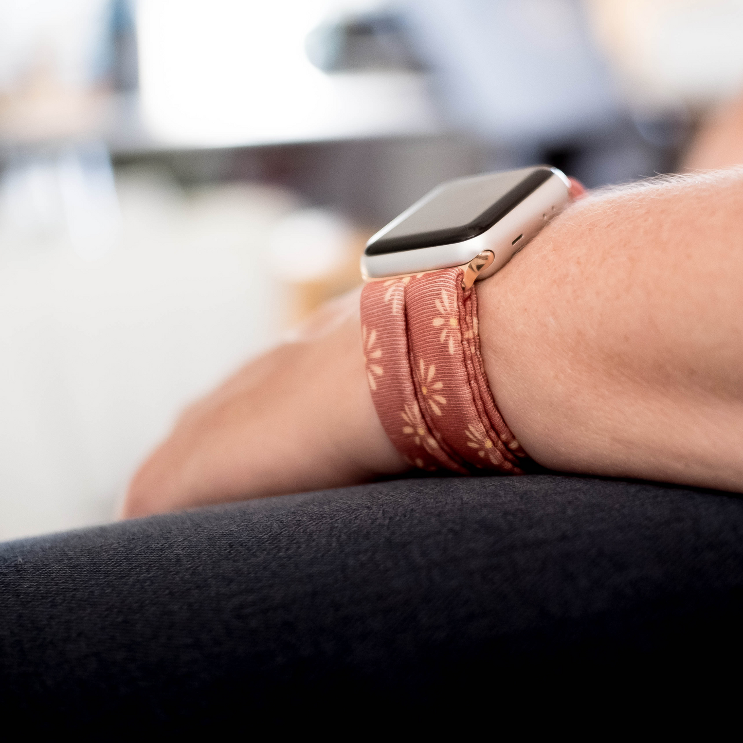 Copper Bloom Yoga Band® featuring a yellow and orange floral print on a rust-copper fabric. A breathable, stretchy watch strap with a patent-pending design compatible with Apple Watch, Fitbit, and Samsung Galaxy models.