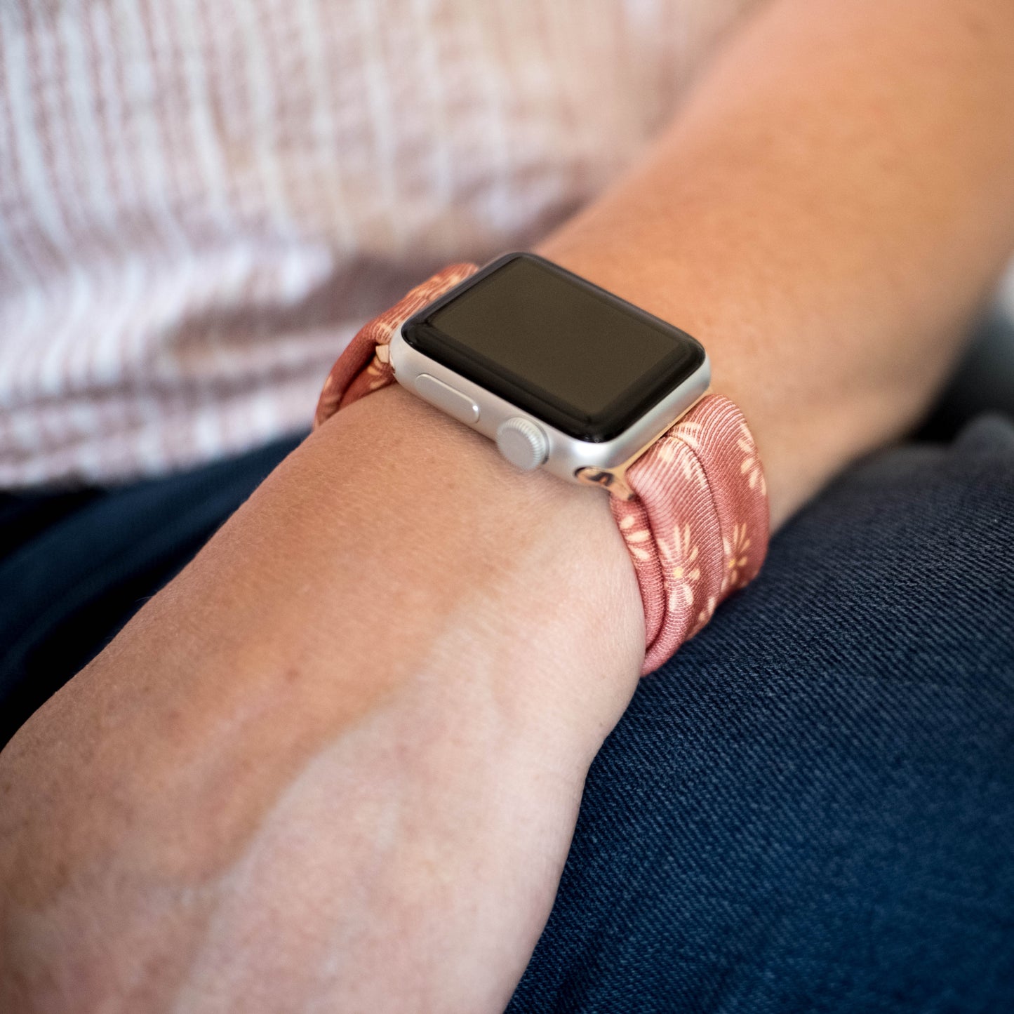 Copper Bloom Yoga Band® featuring a yellow and orange floral print on a rust-copper fabric. A breathable, stretchy watch strap with a patent-pending design compatible with Apple Watch, Fitbit, and Samsung Galaxy models.