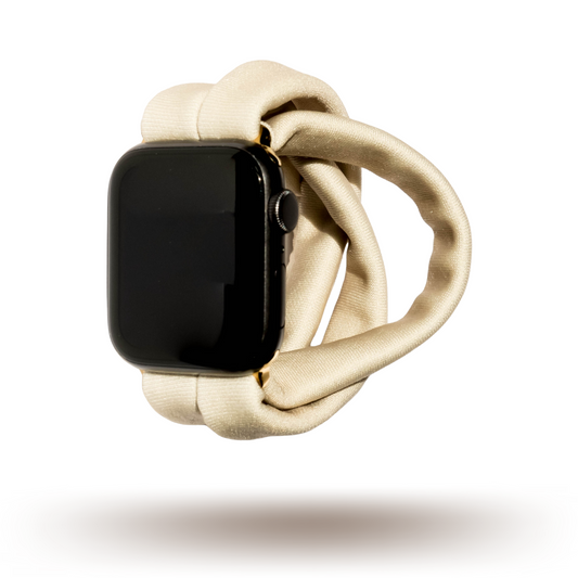 Desert Khaki Yoga Band® in a solid light tan knit fabric. A breathable, stretchy watch strap with a patent-pending design compatible with Apple Watch, Fitbit, and Samsung Galaxy models.