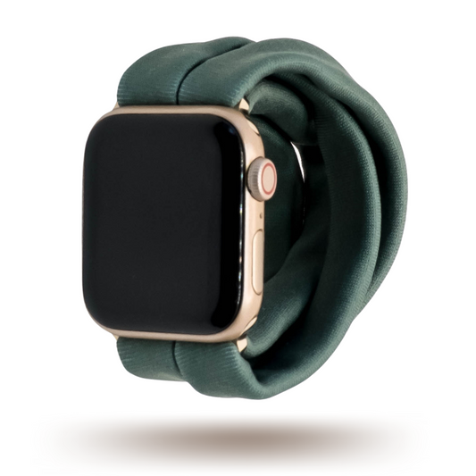 Evergreen Fog Yoga Band® in a solid dark green-grey knit fabric. A breathable, stretchy watch strap with a patent-pending design compatible with Apple Watch, Fitbit, and Samsung Galaxy models.