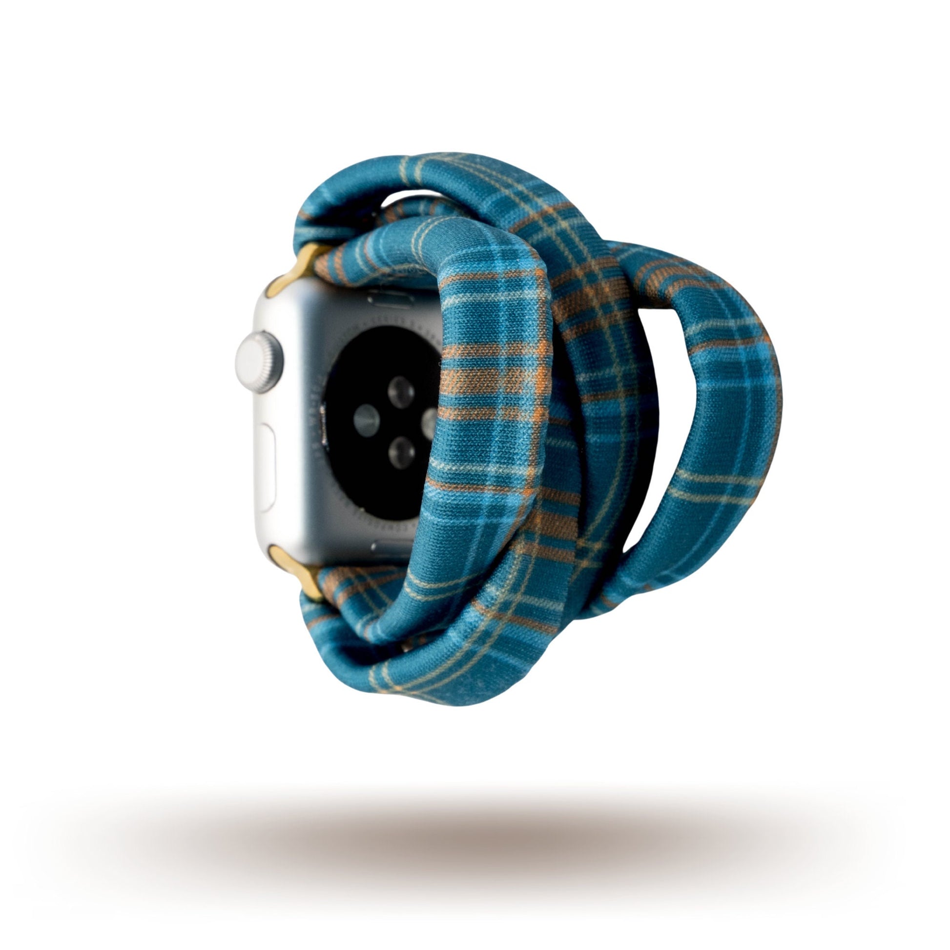 Fall Flannel Yoga Band® featuring a classic blue and green plaid pattern. A breathable, stretchy watch strap with a patent-pending design compatible with Apple Watch, Fitbit, and Samsung Galaxy models.