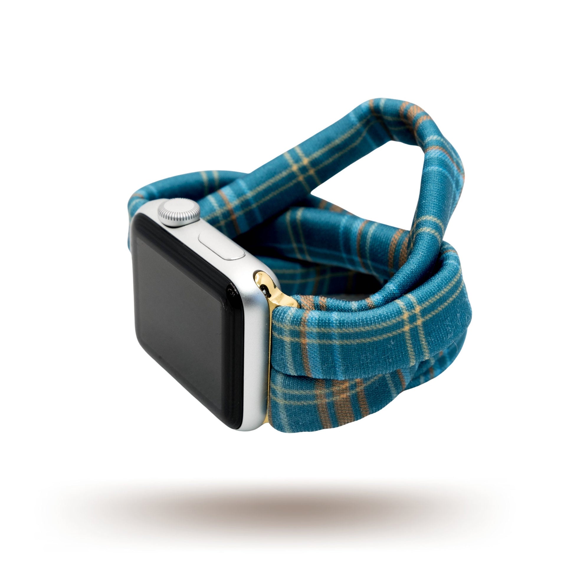Fall Flannel Yoga Band® featuring a classic blue and green plaid pattern. A breathable, stretchy watch strap with a patent-pending design compatible with Apple Watch, Fitbit, and Samsung Galaxy models.