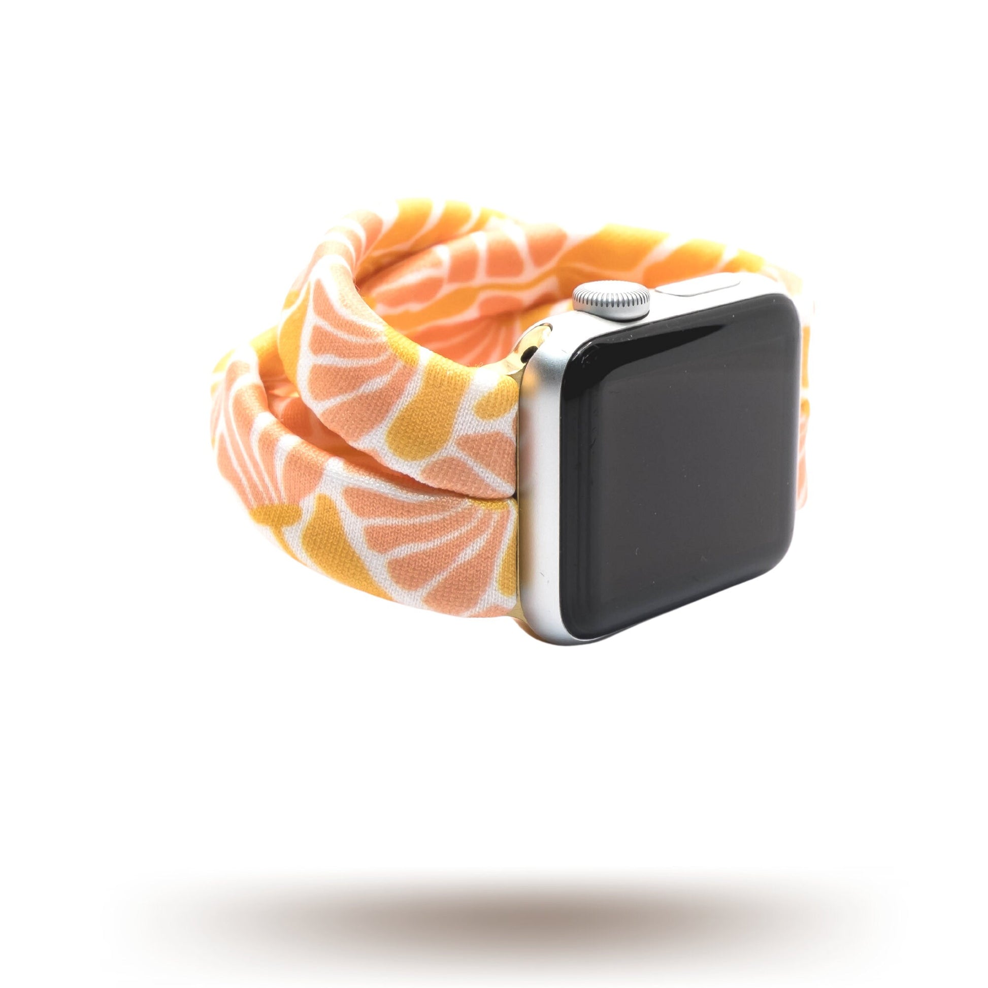 Flower Market Yoga Band® featuring a vibrant pink, orange, and white floral pattern. A breathable, stretchy watch strap with a patent-pending design compatible with Apple Watch, Fitbit, and Samsung Galaxy models.