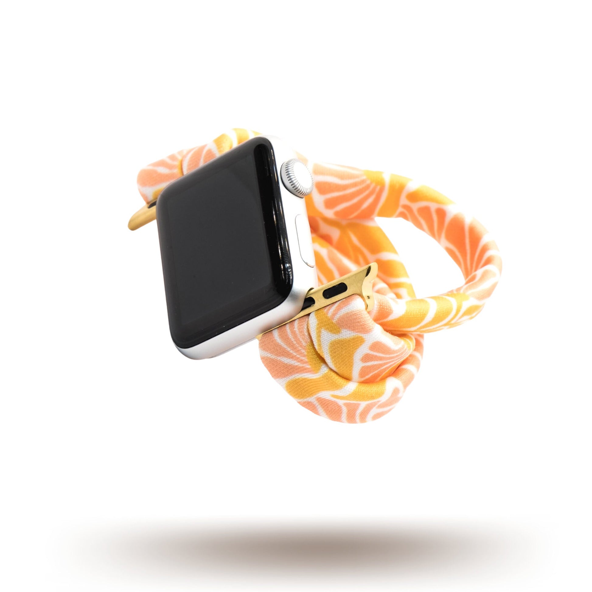 Flower Market Yoga Band® featuring a vibrant pink, orange, and white floral pattern. A breathable, stretchy watch strap with a patent-pending design compatible with Apple Watch, Fitbit, and Samsung Galaxy models.