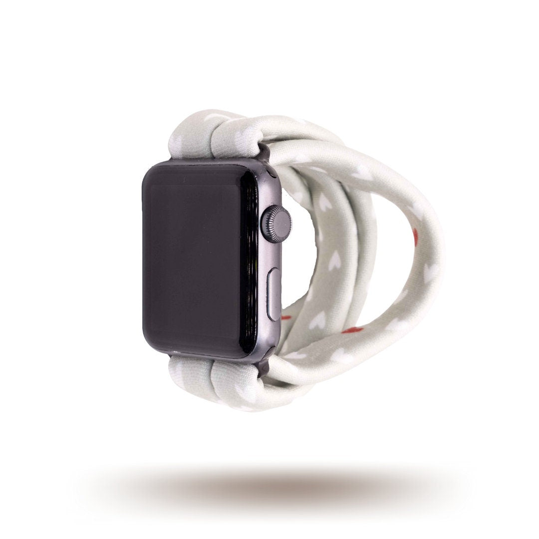 Fulfillment House Yoga Band® featuring a sweet heart print on a grey fabric background. A breathable, stretchy watch strap with a patent-pending design compatible with Apple Watch, Fitbit, and Samsung Galaxy models.