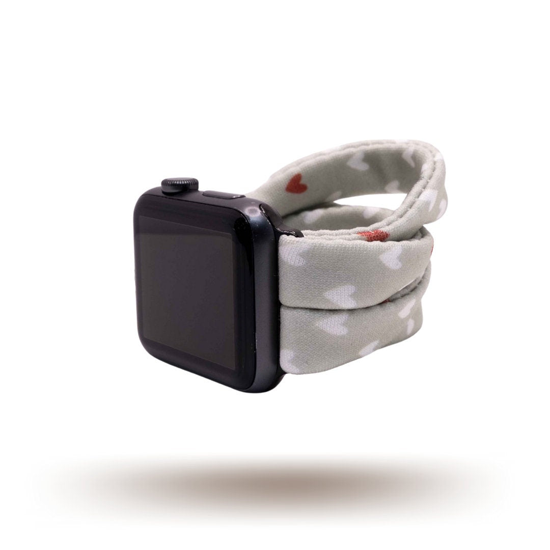Fulfillment House Yoga Band® featuring a sweet heart print on a grey fabric background. A breathable, stretchy watch strap with a patent-pending design compatible with Apple Watch, Fitbit, and Samsung Galaxy models.