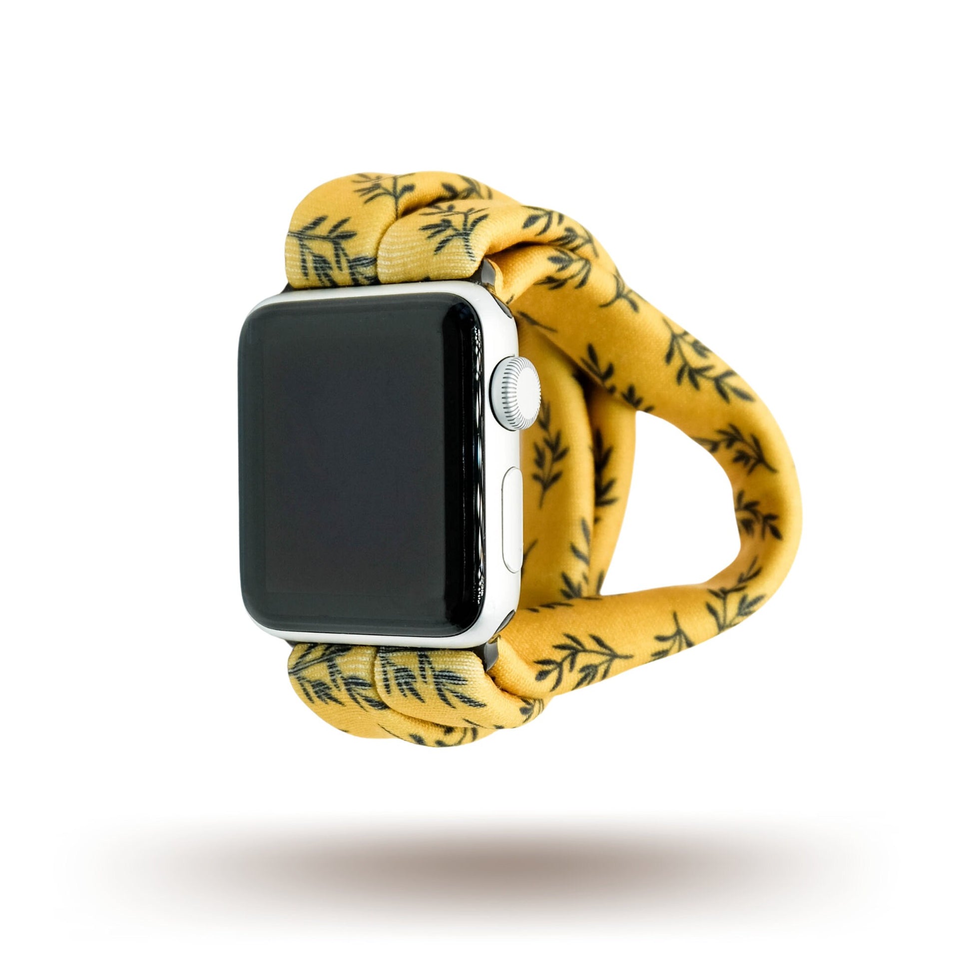 Golden Laurel Yoga Band® featuring a delicate black laurel leaf print on a vibrant goldenrod fabric. A breathable, stretchy watch strap with a patent-pending design compatible with Apple Watch, Fitbit, and Samsung Galaxy models.