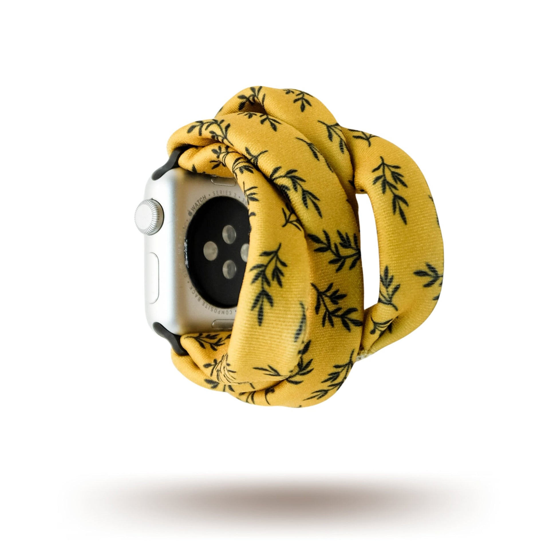 Golden Laurel Yoga Band® featuring a delicate black laurel leaf print on a vibrant goldenrod fabric. A breathable, stretchy watch strap with a patent-pending design compatible with Apple Watch, Fitbit, and Samsung Galaxy models.