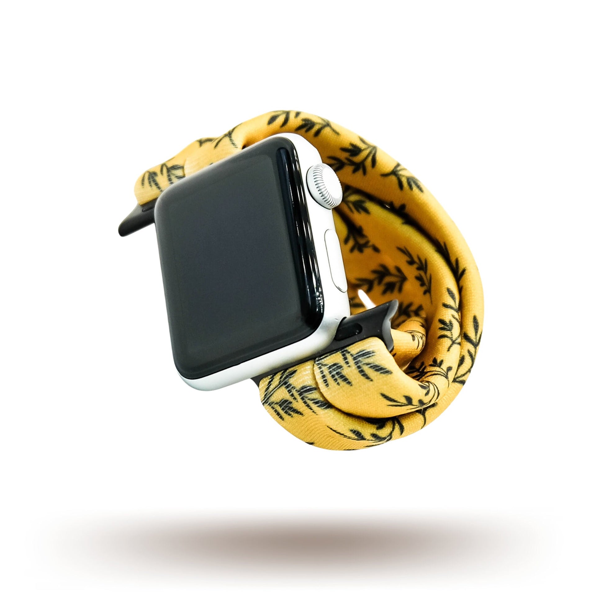 Golden Laurel Yoga Band® featuring a delicate black laurel leaf print on a vibrant goldenrod fabric. A breathable, stretchy watch strap with a patent-pending design compatible with Apple Watch, Fitbit, and Samsung Galaxy models.