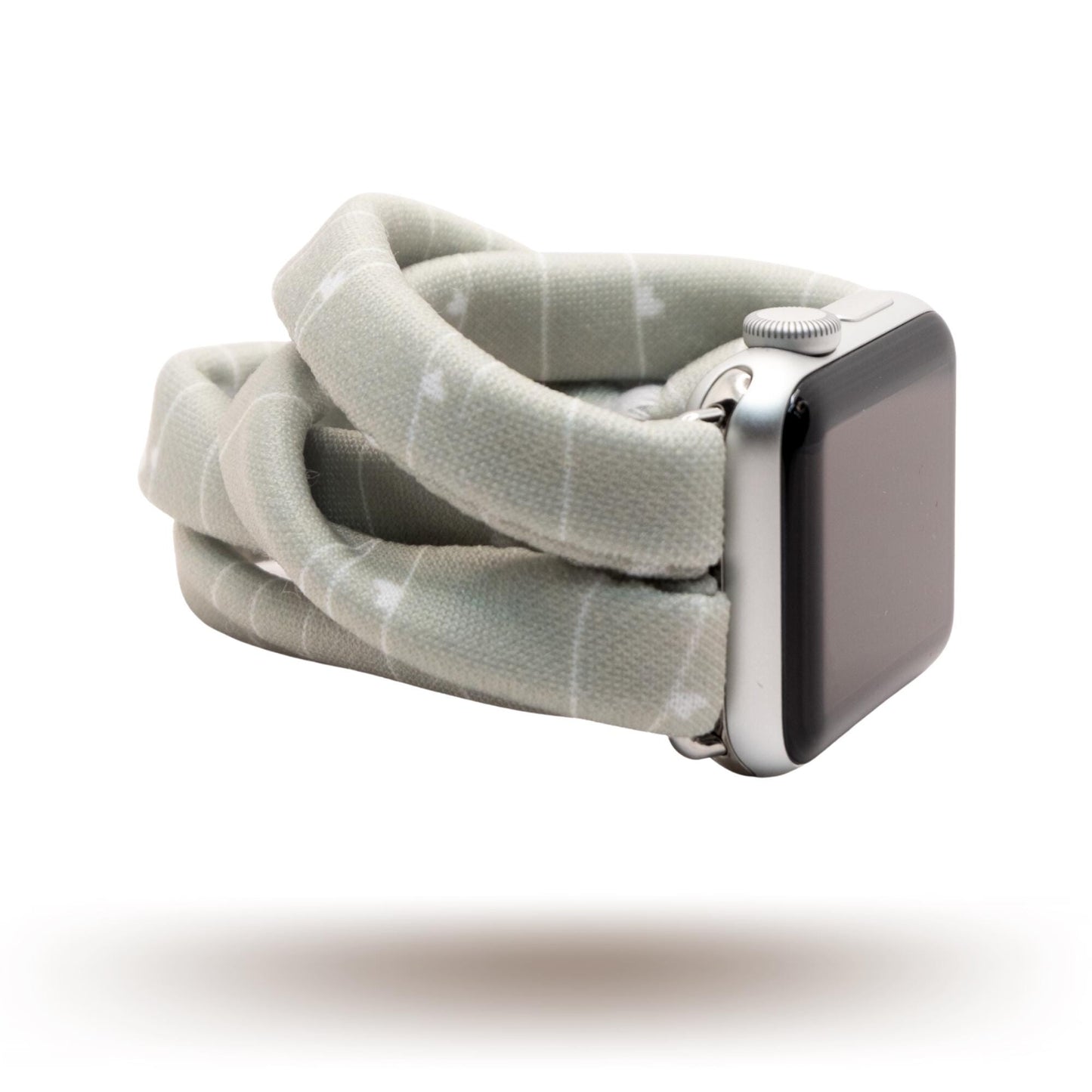 Gray Heartstrings Yoga Band® featuring a delicate string pattern with tiny hearts on a gray fabric. A breathable, stretchy watch strap with a patent-pending design compatible with Apple Watch, Fitbit, and Samsung Galaxy models.