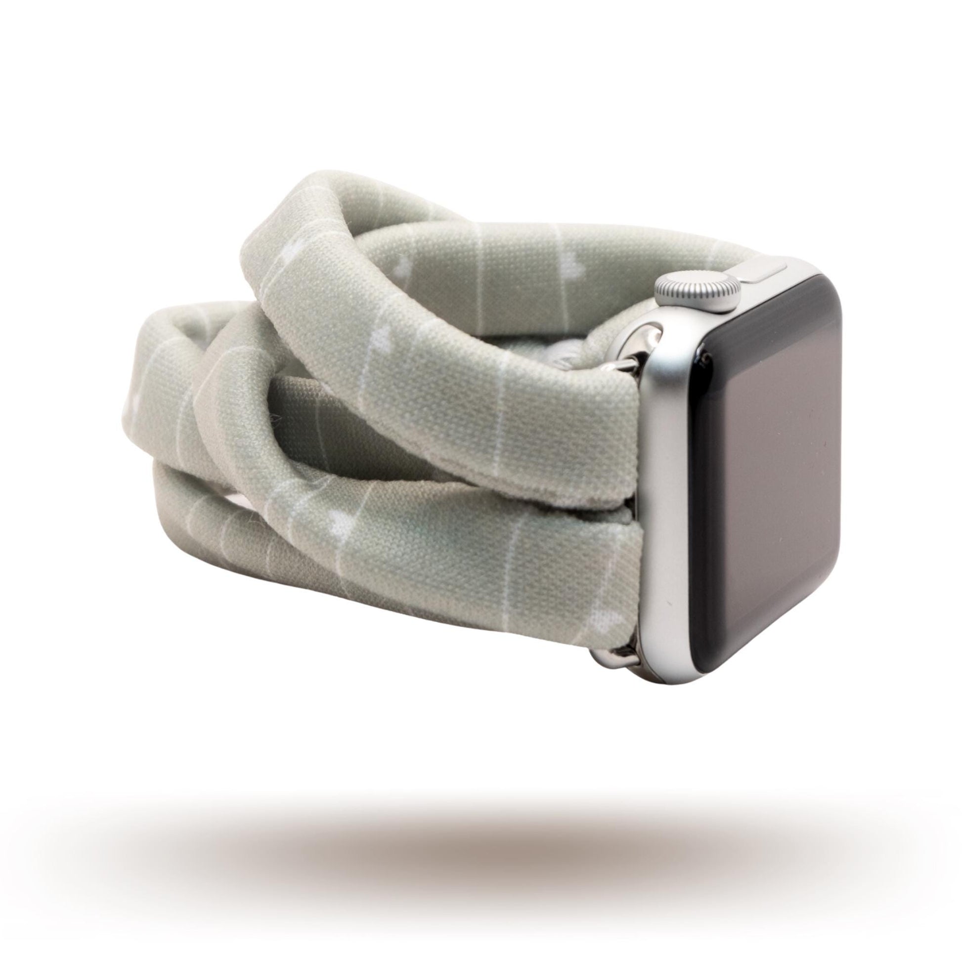 Gray Heartstrings Yoga Band® featuring a delicate string pattern with tiny hearts on a gray fabric. A breathable, stretchy watch strap with a patent-pending design compatible with Apple Watch, Fitbit, and Samsung Galaxy models.