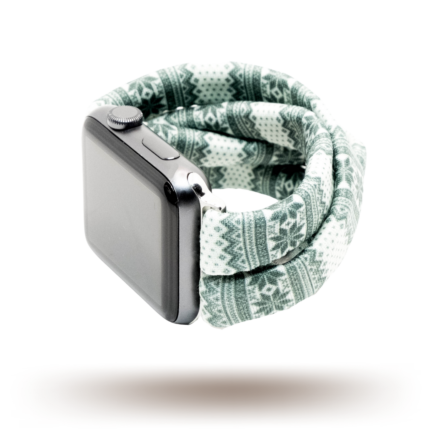 Green Nordic Sweater Yoga Band® featuring a green and white alpine snowflake print. A breathable, stretchy watch strap with a patent-pending design compatible with Apple Watch, Fitbit, and Samsung Galaxy models.