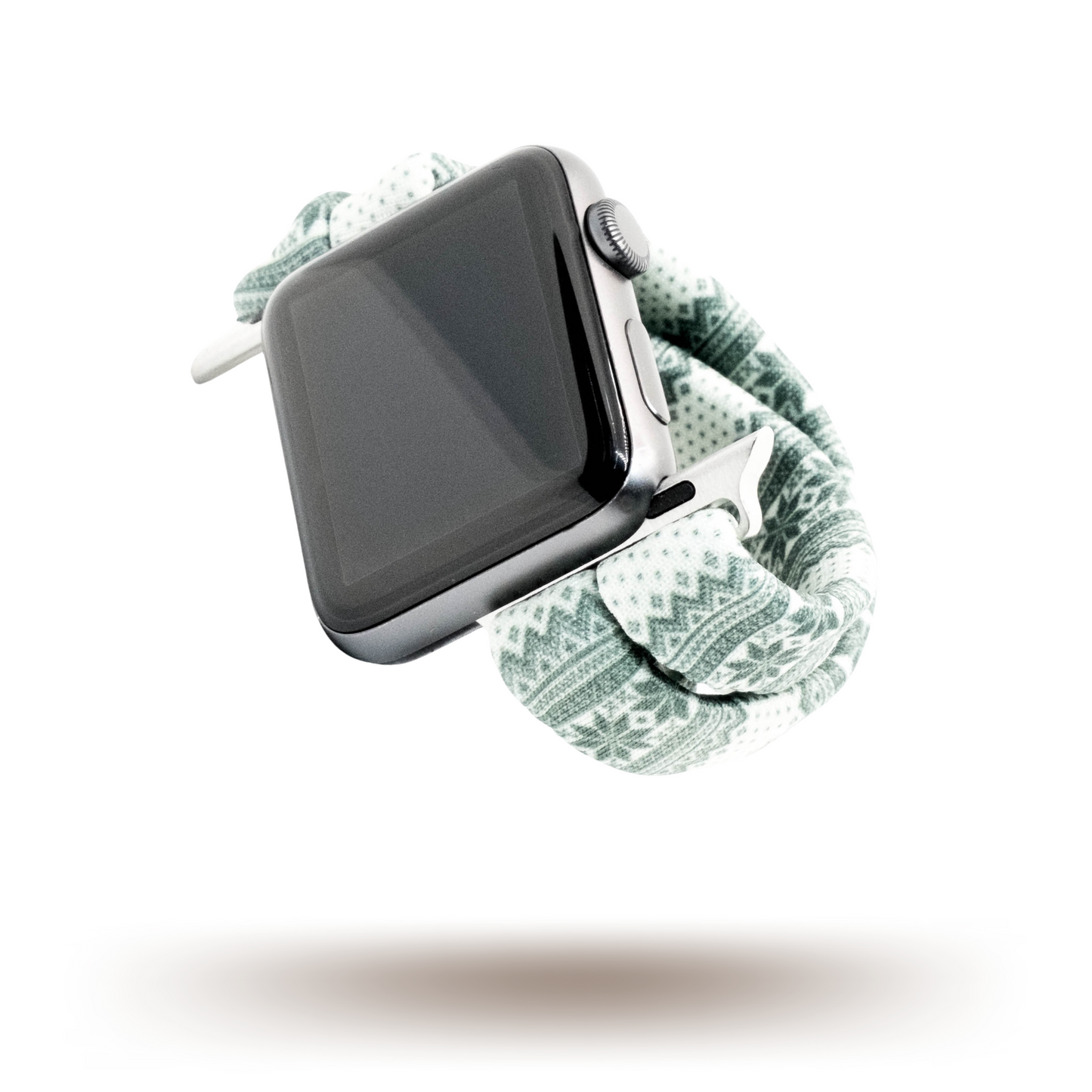 Green Nordic Sweater Yoga Band® featuring a green and white alpine snowflake print. A breathable, stretchy watch strap with a patent-pending design compatible with Apple Watch, Fitbit, and Samsung Galaxy models.
