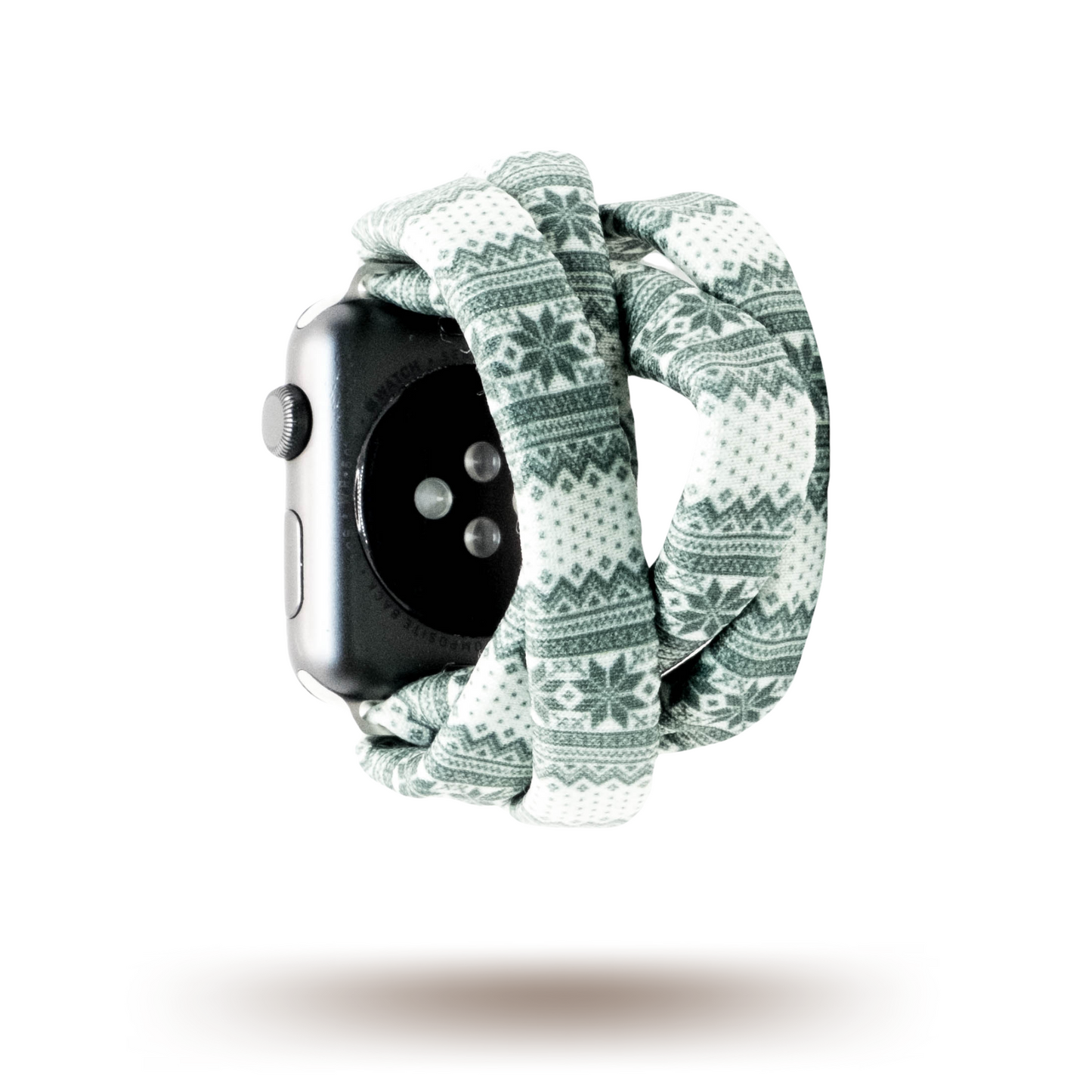 Green Nordic Sweater Yoga Band® featuring a green and white alpine snowflake print. A breathable, stretchy watch strap with a patent-pending design compatible with Apple Watch, Fitbit, and Samsung Galaxy models.