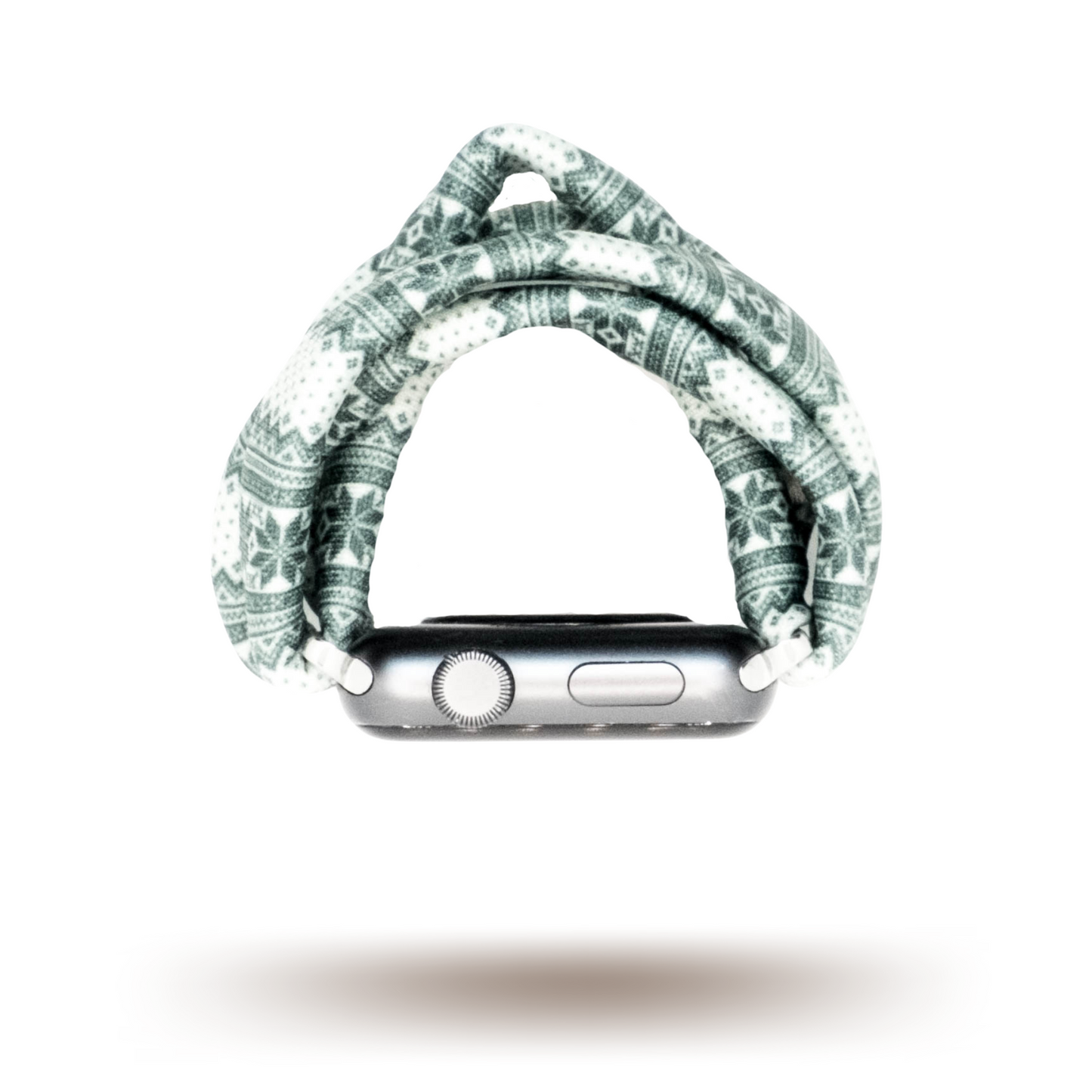 Green Nordic Sweater Yoga Band® featuring a green and white alpine snowflake print. A breathable, stretchy watch strap with a patent-pending design compatible with Apple Watch, Fitbit, and Samsung Galaxy models.