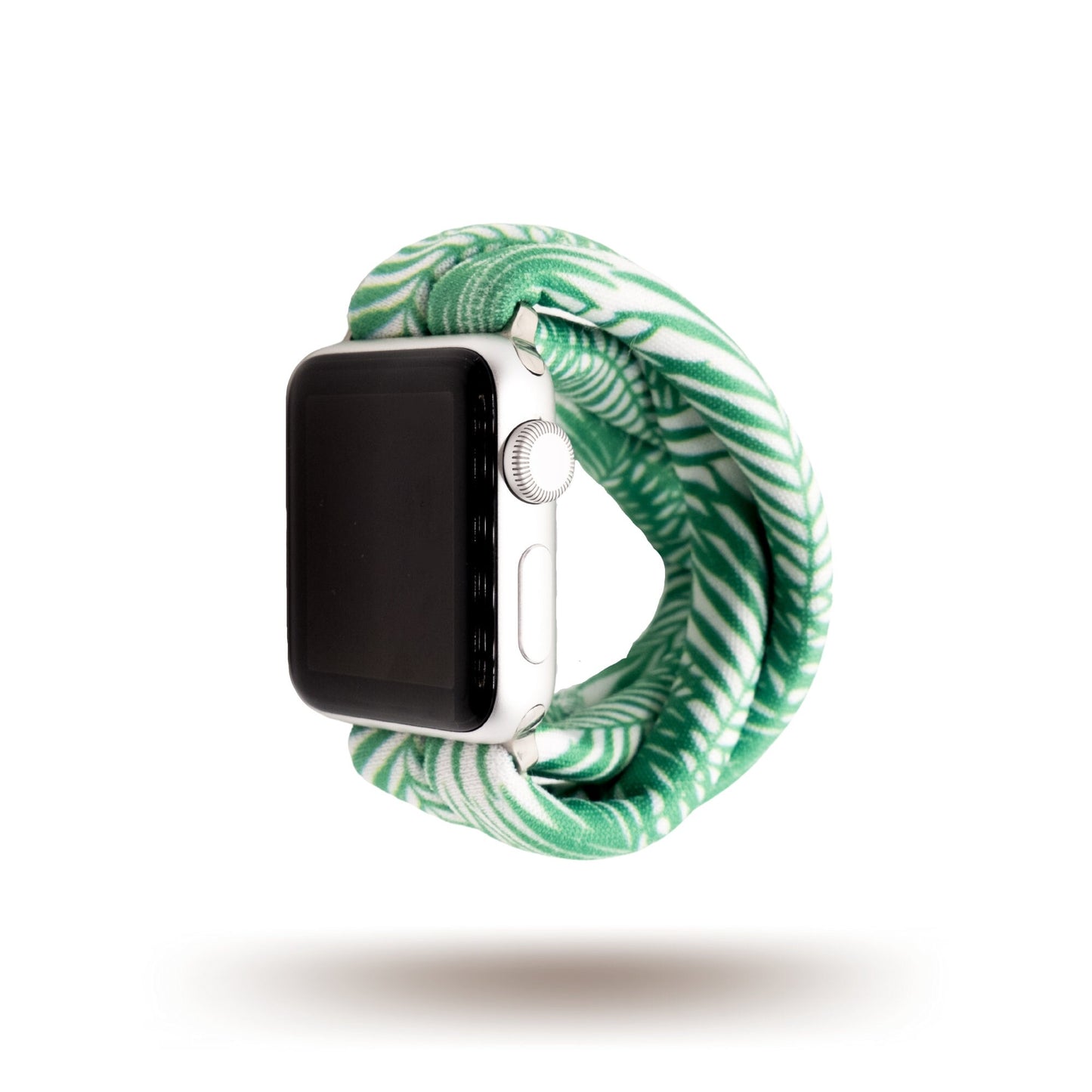 Green Palms Yoga Band® featuring a green and white tropical palm frond print. A breathable, stretchy fabric watch strap with a patent-pending design compatible with Apple Watch, Fitbit, and Samsung Galaxy models.