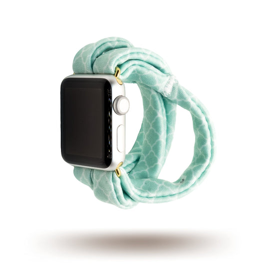 Green Quatrefoil Yoga Band® featuring a classic light green and white geometric pattern. A breathable, stretchy watch strap with a patent-pending design compatible with Apple Watch, Fitbit, and Samsung Galaxy models.