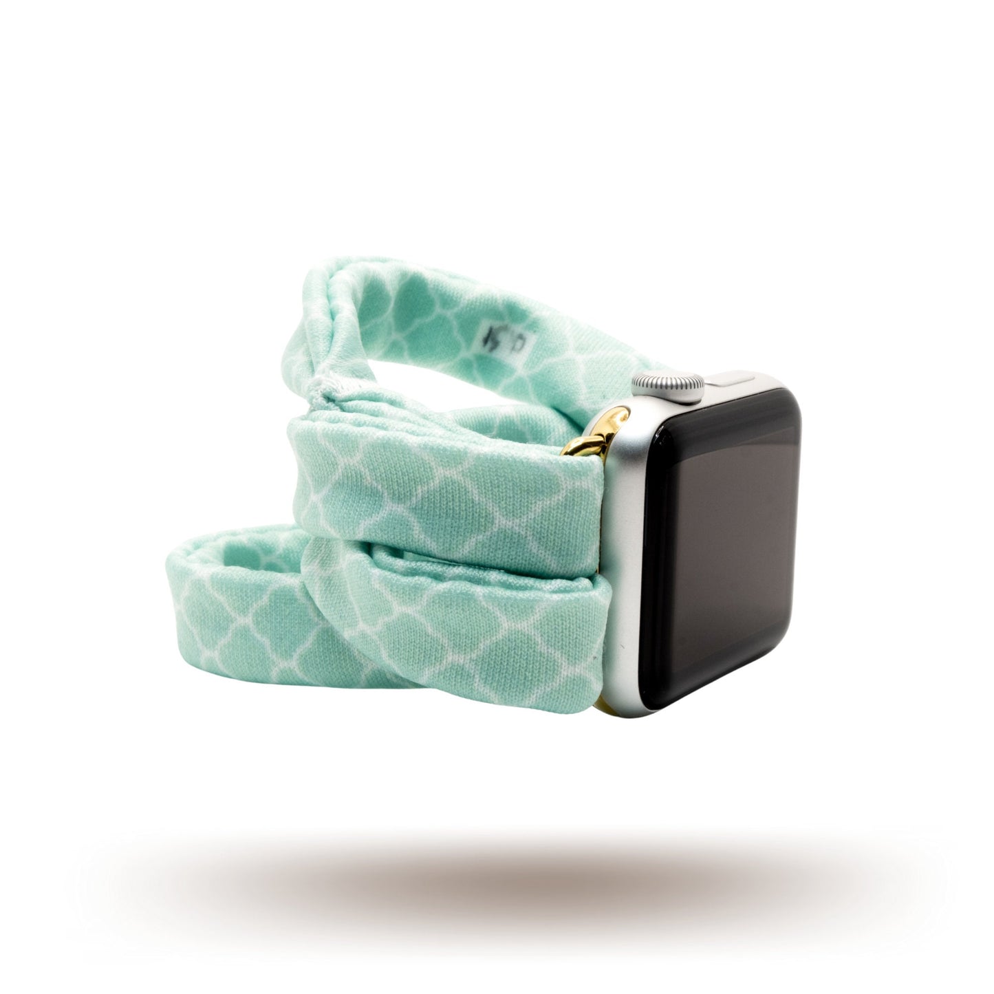 Green Quatrefoil Yoga Band® featuring a classic light green and white geometric pattern. A breathable, stretchy watch strap with a patent-pending design compatible with Apple Watch, Fitbit, and Samsung Galaxy models.