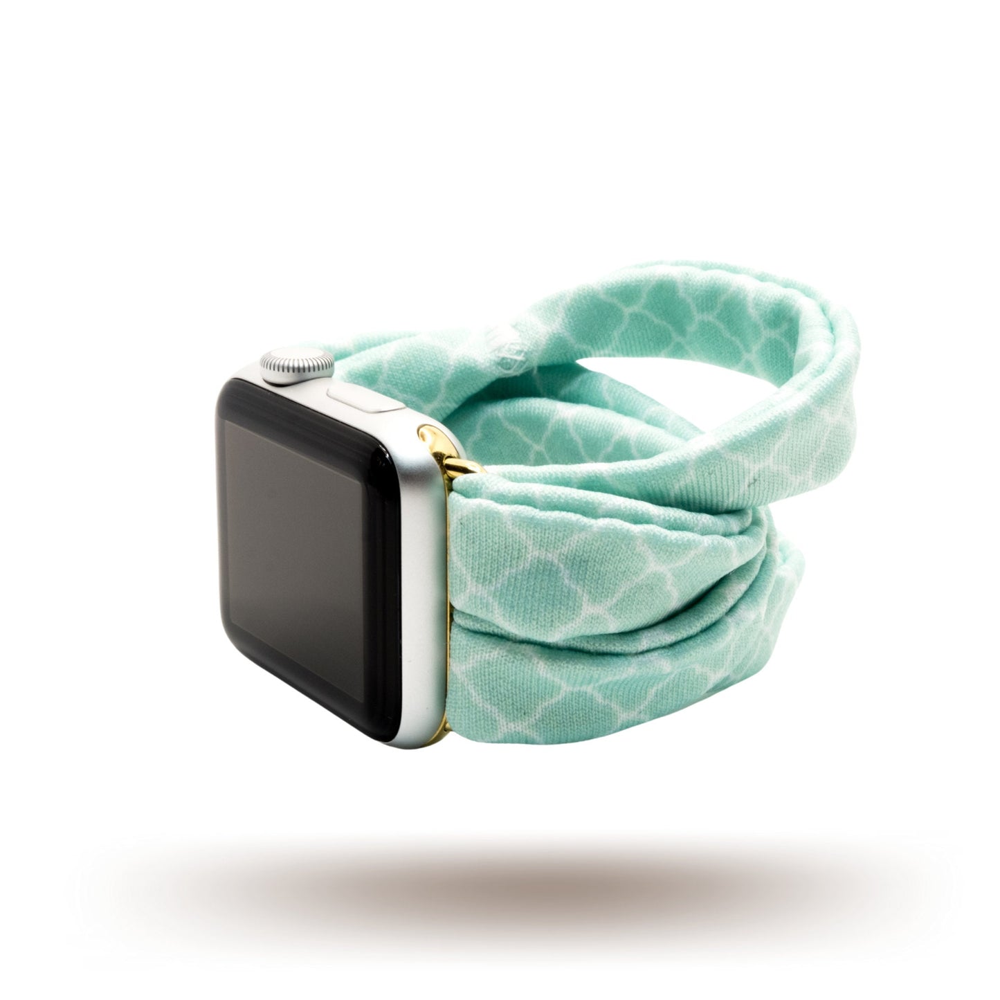 Green Quatrefoil Yoga Band® featuring a classic light green and white geometric pattern. A breathable, stretchy watch strap with a patent-pending design compatible with Apple Watch, Fitbit, and Samsung Galaxy models.