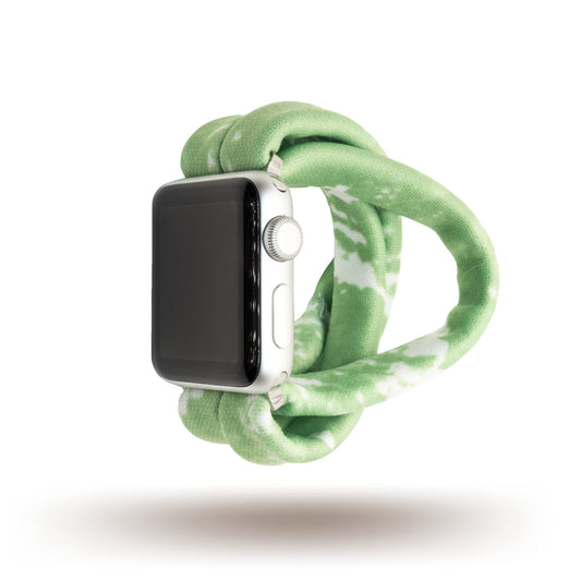 Green Tie Dye Yoga Band® featuring a swirling green and white batik pattern. A breathable, stretchy fabric watch strap with a patent-pending design compatible with Apple Watch, Fitbit, and Samsung Galaxy models.