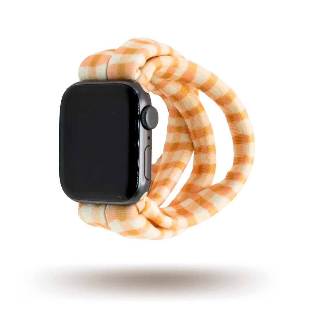 Harvest Plaid Yoga Band® featuring an earthy yellow and orange plaid pattern. A breathable, stretchy fabric watch strap with a patent-pending design compatible with Apple Watch, Fitbit, and Samsung Galaxy models.