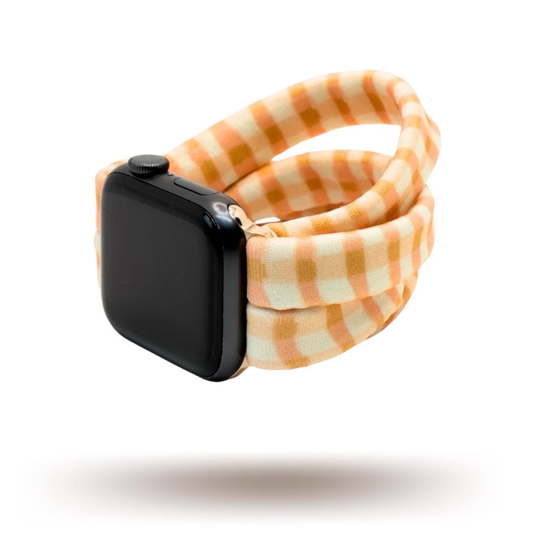 Harvest Plaid Yoga Band® featuring an earthy yellow and orange plaid pattern. A breathable, stretchy fabric watch strap with a patent-pending design compatible with Apple Watch, Fitbit, and Samsung Galaxy models.