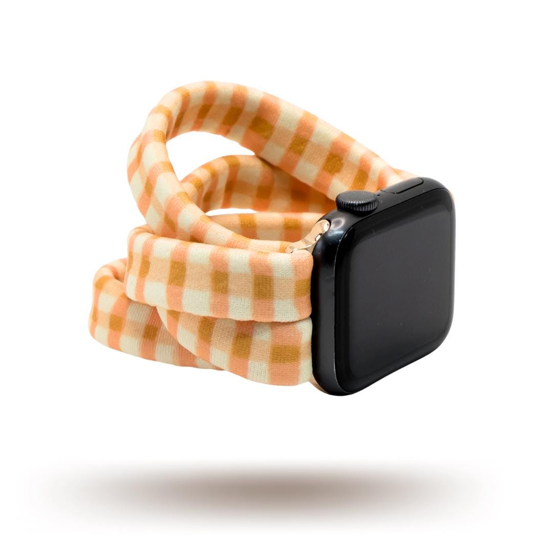 Harvest Plaid Yoga Band® featuring an earthy yellow and orange plaid pattern. A breathable, stretchy fabric watch strap with a patent-pending design compatible with Apple Watch, Fitbit, and Samsung Galaxy models.