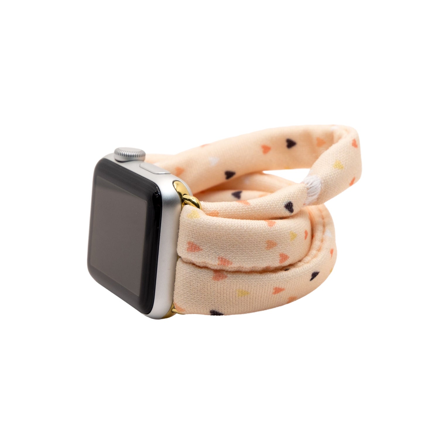 Heartbeat Yoga Band® featuring a tiny heart print in peach, cream, and pink tones. A breathable, stretchy fabric watch strap with a patent-pending design compatible with Apple Watch, Fitbit, and Samsung Galaxy models.