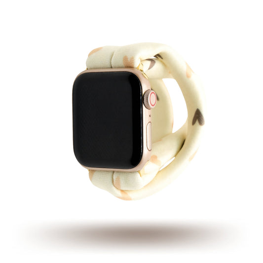 Hearts and Cream Yoga Band® featuring a tan and brown heart print on a cream fabric background. A breathable, stretchy watch strap with a patent-pending design compatible with Apple Watch, Fitbit, and Samsung Galaxy models.