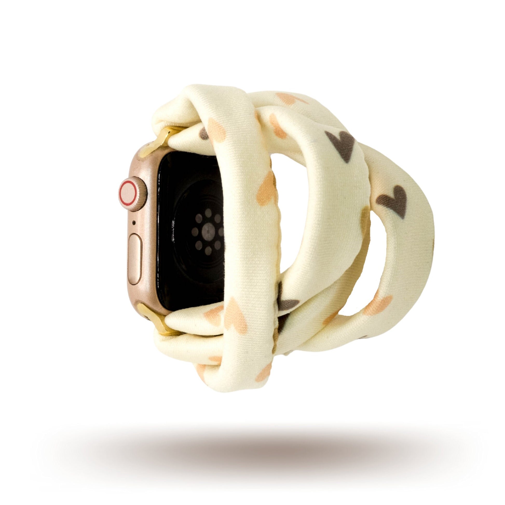Hearts and Cream Yoga Band® featuring a tan and brown heart print on a cream fabric background. A breathable, stretchy watch strap with a patent-pending design compatible with Apple Watch, Fitbit, and Samsung Galaxy models.