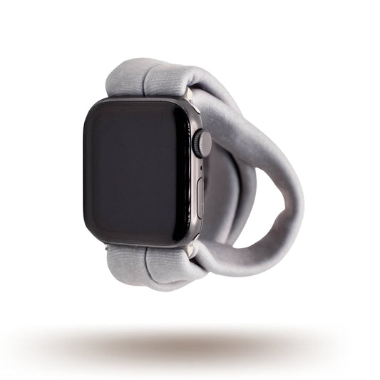 Solid Gray Yoga Band® in a neutral heather gray knit fabric. A breathable, stretchy watch strap with a patent-pending design compatible with Apple Watch, Fitbit, and Samsung Galaxy models.